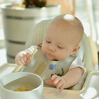baby eating with prespoon