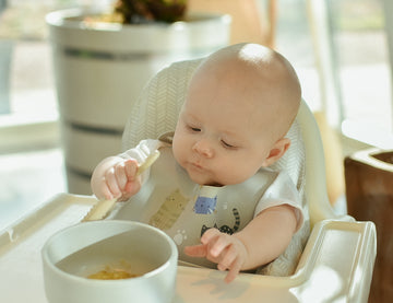baby eating with prespoon