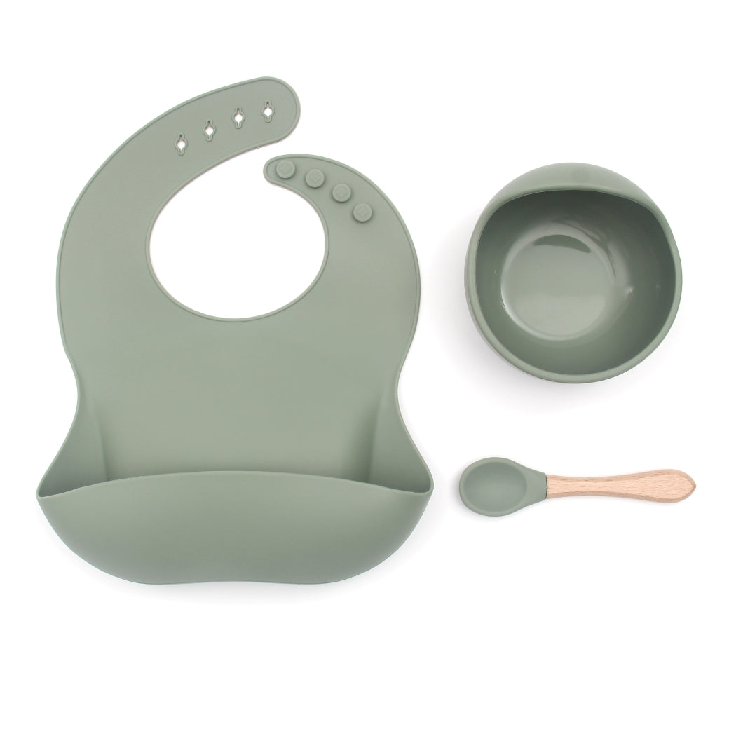 Baby feeding set with bib, suction bowl and spoon in gree